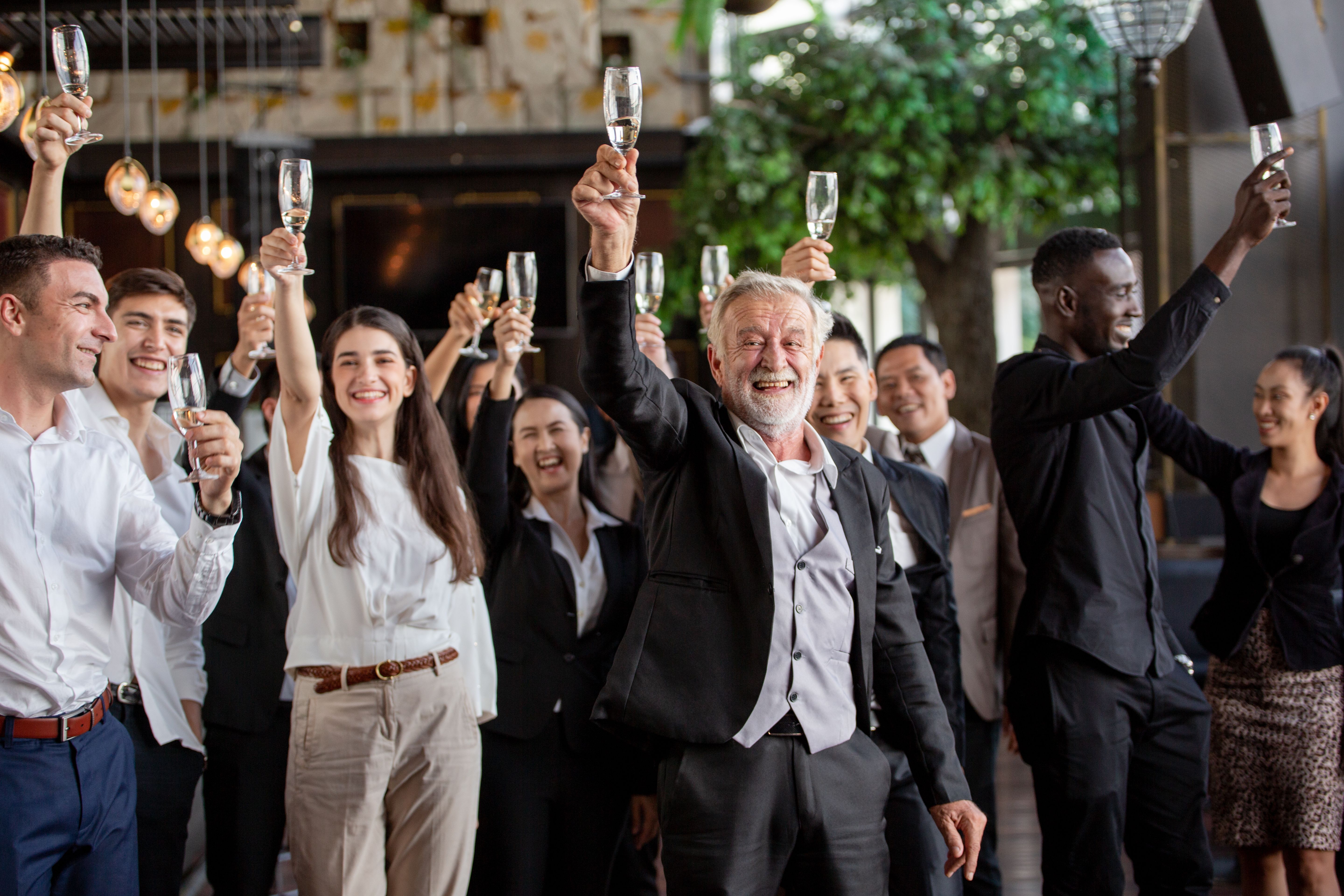 A group of colleagues raising a glass to their business success